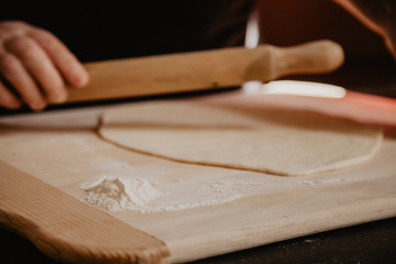 pizza prepare dough hand topping