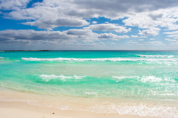 Fototapeta premium Waves on Caribbean sea. Crystal clear water, Playa Delfines, Cancun, Mexico