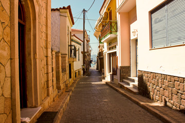 Fototapeta na wymiar The road which leads to the port, Aegina town, Aegina Island, Greece