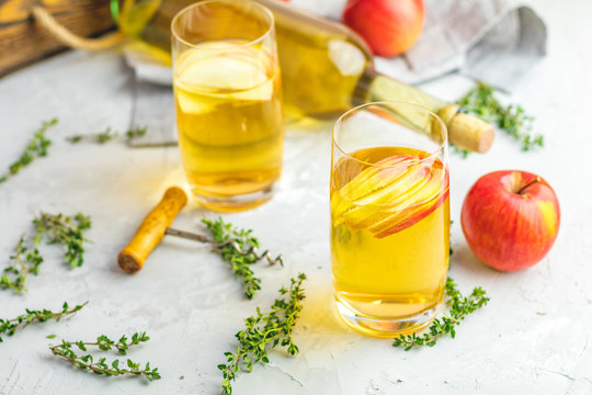 Bottle and glasses of homemade organic apple cider
