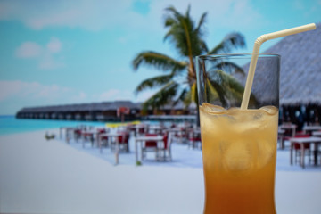 Sex on the Beach cocktail highball glass with straw