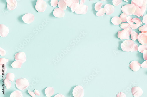 Flowers composition. Rose flower petals on pastel blue background. Valentine's Day, Mother's Day concept. Flat lay, top view, copy space