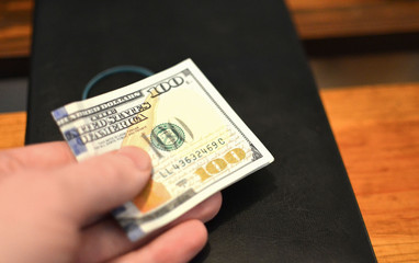 International bribe problem. Investment, financial , donation concept, or bribe, corruption concept. Prepayment service gratitude concept. Salary. Giving hand with dollars