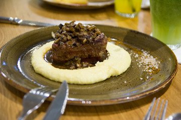 Beef fillet with mashed potato and mushrooms