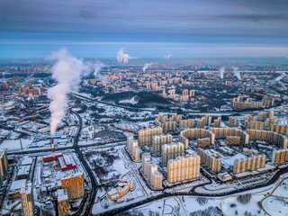 Aerial view of the colorful frosty winter evening and residential areas in Moscow.