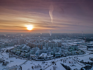 Aerial view of the colorful frosty winter evening and residential areas in Moscow.
