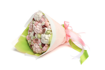 Original delicious edible bouquet consisting of candies, marshmallows, berries of raspberries and zephyrs on a white background as a gift