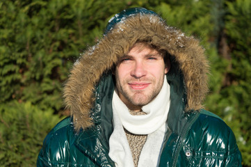 Man unshaven wear warm jacket with fur snowy nature background. Hipster winter fashion. Prepared...