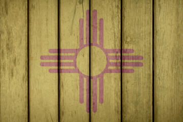 Fototapeta premium USA Politics News Concept: US State New Mexico Flag Wooden Fence