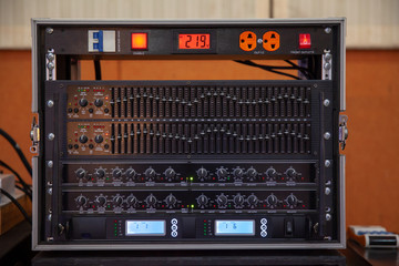 sound system by mixer equalizer in concert or wedding hall. image for background, and copy space.