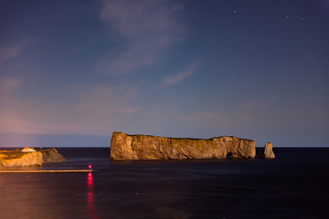 Famous Rocher Perce rock in Gaspe Peninsula, Quebec, Gaspesie region in Canada at dark night sky...