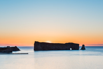 Famous Rocher Perce rock silhouette in Gaspe Peninsula, Quebec, Gaspesie region in Canada with sky...