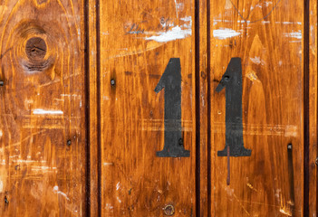 number 11 on door of storage room for tenants in century-old apartment building in stockholm