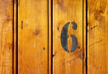 number 6 on door of storage room for tenants in century-old apartment building in stockholm