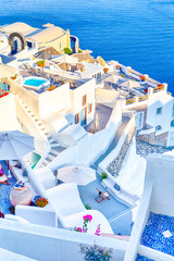European Destinations. Amazing View of Classic White Houses and Blue Colors of Oia Village Houses And Architecture on Santorini Island in Greece.