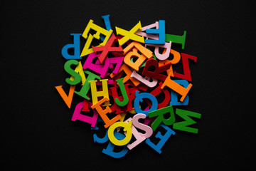 colored letters on a dark background. day of knowledge. school.