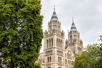 Fototapeta na wymiar Exterior historic architecture of Natural History Museum in Kensington Chelsea area of London, UK during cloudy summer autumn day looking up and nobody