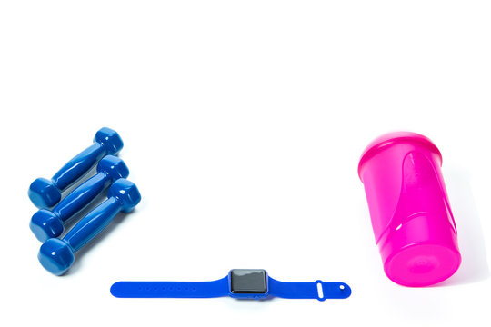 Sport Concepts. Three Barbells with Fitness Watch and Shaker Lay Together on White Surface. Copyspace image.