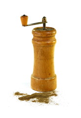 Pepper mill on a white isolated background with peppers