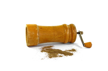 Pepper mill on a white isolated background with peppers