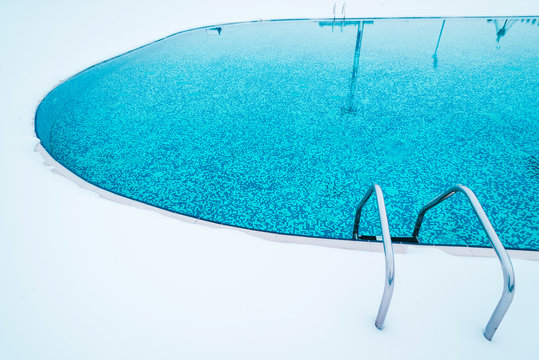 Swimming pool with snow during winter