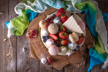 Luxurious Purple cake decorated with a bise, marshmallow, berries and fresh flowers.  Wedding sv. valentine cake