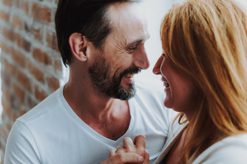 Love and tender between happy adult couple