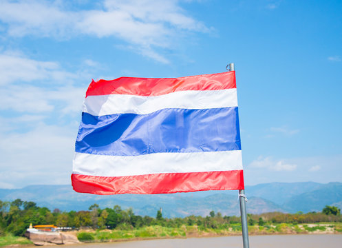 Asian flag on blue sky background.