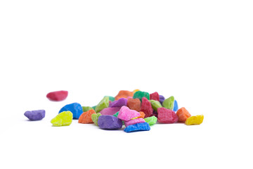 multi color pebbles for decoration on white background