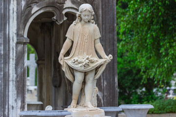 statue of a girl in cemitery