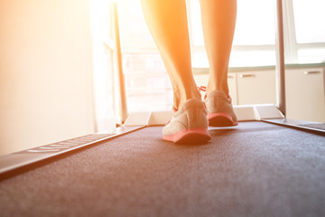 Woman doing fitness on a treadmill