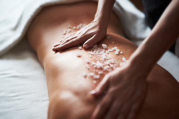 Close up of healthy massage with mineral salt