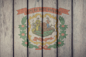 USA Politics News Concept: US State West Virginia Flag Wooden Fence