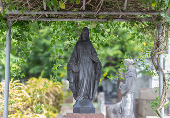 statue of woman in cemitery