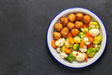 Meatballs with broccoli and a cauliflower