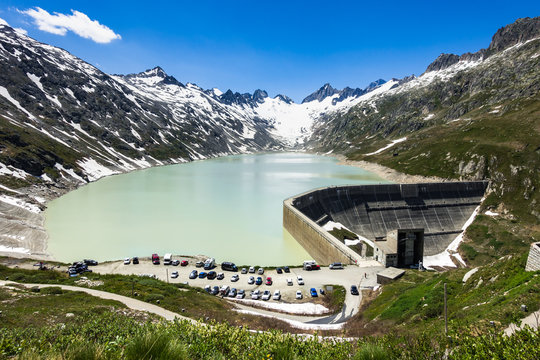Oberaarsee dam and Oberaar glacier near Grimsel Pass in a beautiful summer day, Switzerland