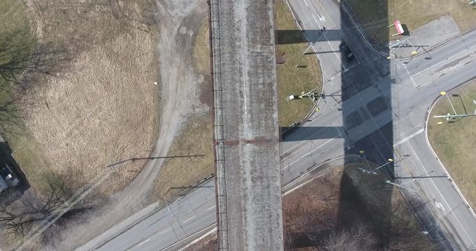 Flying Over Old Abandoned Bridge With Traffic Below Aerial View