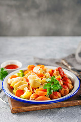 Meatballs with Conchiglie, broccoli and a cauliflower in a plate on a table. Diet food. Copy space