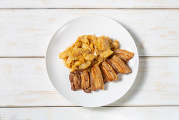  Stew of pork belly with apples, onion and sugar. Aebleflæsk. The view from the top. Copy-space.   