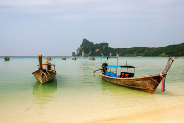 Longtail boats anchored at Ao Loh Dalum beach on Phi Phi Don Island, Krabi Province, Thailand