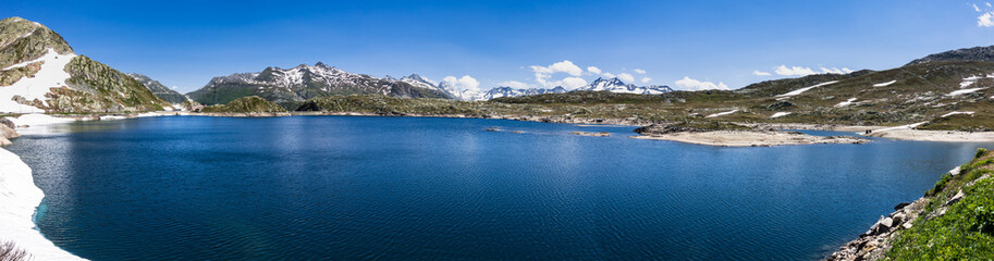 Fototapeta premium Wide alpine panorama at Grimsel Pass with Totensee lake in the foreground, Switzerland
