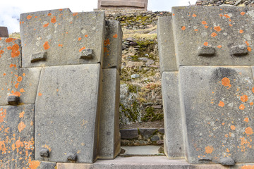 Cusco, Peru - Oct 22, 2018: Trapezoidal stone windows and doors at the Ollanytambo archaeological site in the Sacred Valley