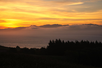 Sunset over the bay on Kaikoura peninsula, South Island, New Zealand