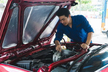 Car mechanic, hold wrench working in garage. Repair service. - Image