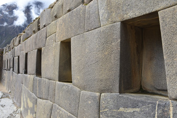 Cusco, Peru - Oct 22, 2018: Trapezoidal stone windows and doors at the Ollanytambo archaeological site in the Sacred Valley