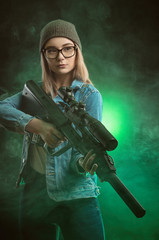 girl with a gun posing on a black background sniper scope