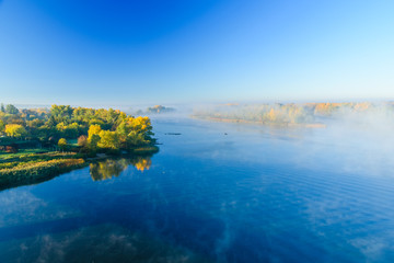 Fog over the water on a river Dnieper on autumn