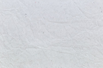 Obraz premium Crumpled white recycled paper background for business communication and education concept design.