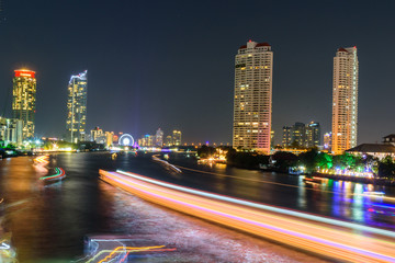 Fototapeta na wymiar blur light of boat moving at the river of City