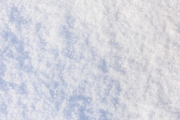 Texture of the white fluffy snow for background